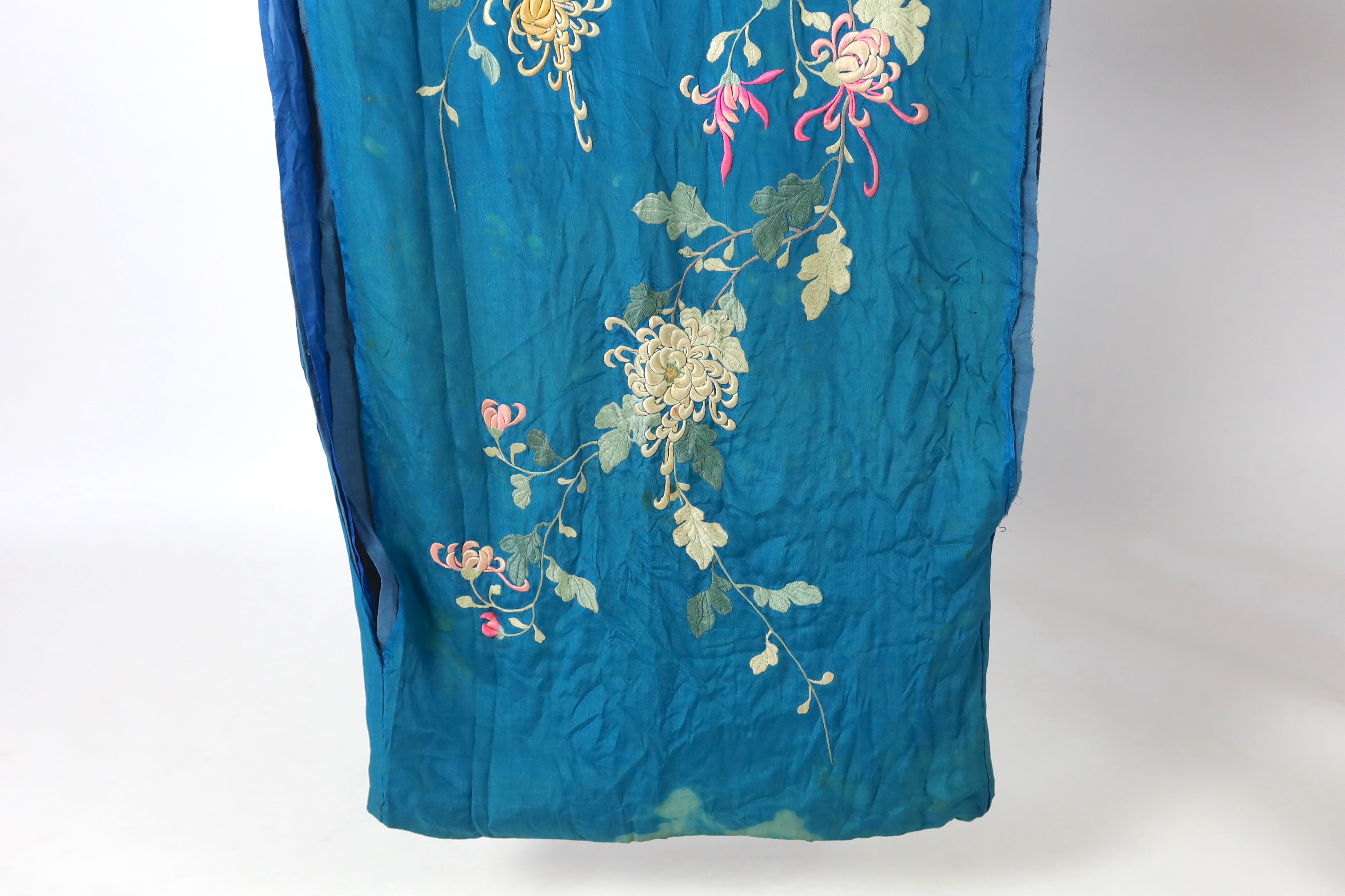 An early 20th century silk crêpe Japanese kimono and fringed tie belt, the back panel heavily embroidered with trailing chrysanthemum type flowers and leaves. This item is being sold for the back panel only and is with a